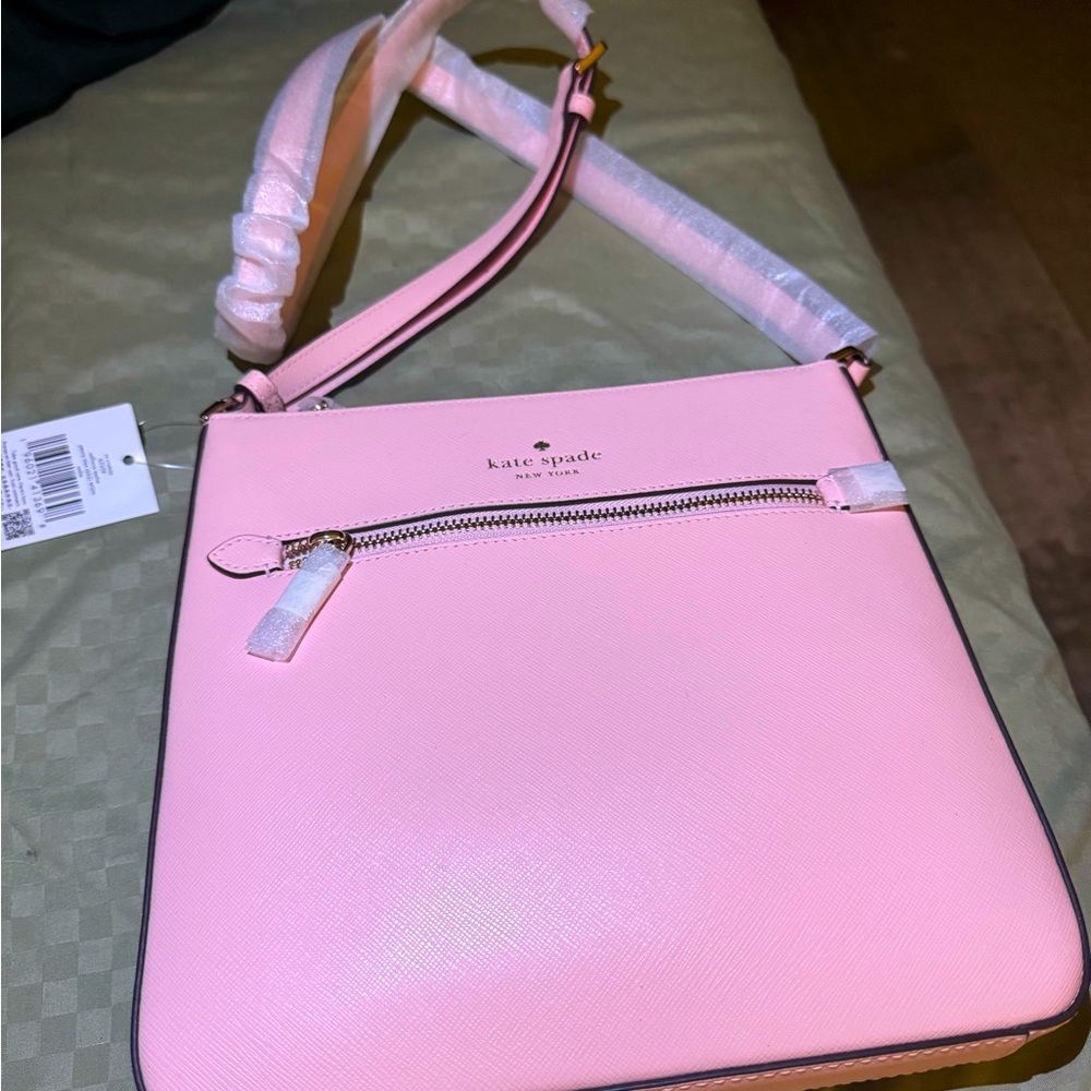 Light pink Kate Spade purse. Brand new with tags.